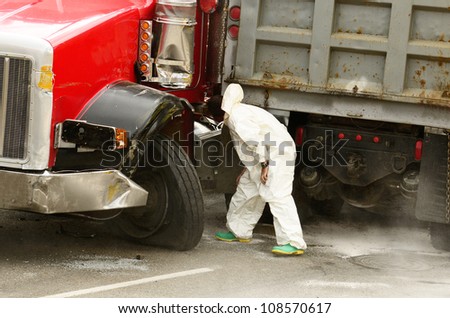 ROSEBURG, OR - JULY 20: Hazardous materials cleanup company at a  four vehicle accident involving two large trucks resulted in a single injury and a diesel fuel spill. July 20, 2012 in Roseburg Oregon