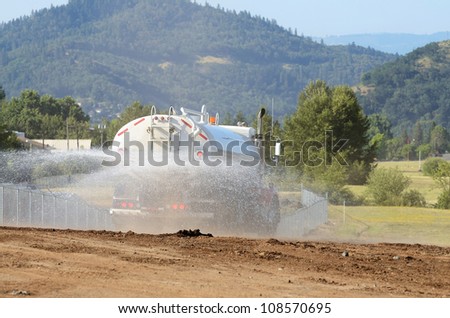 at a large construction site removing a hill during an airport runway expansion project