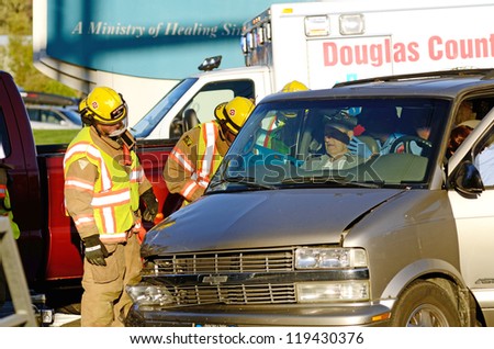 ROSEBURG OR - NOVEMBER 6: Two vehicle accident at hospital entrance results in injuries to passenger in one of the cars who had to be extricated by fire department in Roseburg Oregon, November 6, 2012