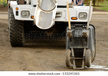 Concrete being placed into a wheel barrow to be tested at a large commercial housing development in Oregon