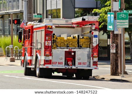 PORTLAND, OR - JULY 14, 2013: A fire engine responds to a medical emergency in the industrial areal of Portland Oregon on July 14th, 2013