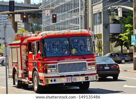 PORTLAND, OR - JULY 14: A fire engine responds to a medical emergency in the industrial areal of Portland Oregon on July 14th, 2013