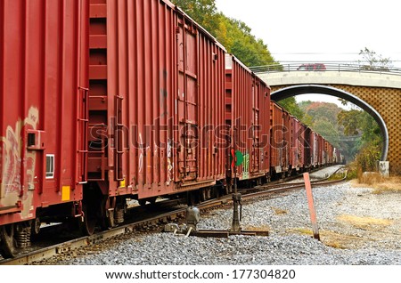 Rail road train coming through a small bridge in rural Louisiana