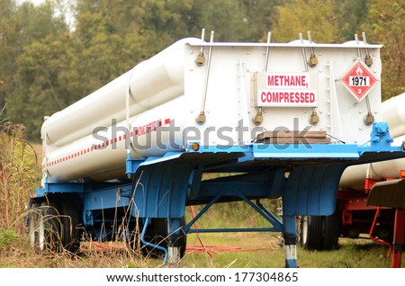 Methane, Compressed being off loaded from a high pressure cylinder gas transport trailer at a remote site for a chemical plant in rural Alabama