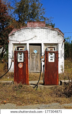 Old small roadside gas or fuel service station along an old hwy replaced by a freeway several miles away in southern United States