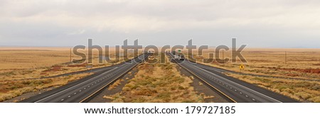 Interstate 40 follows the original Route 66 through the high desert of northeastern Arizona as a rain storm rolls through