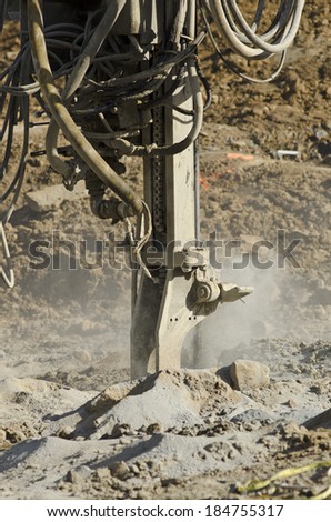 Air Track Rock Drill, Drifter Hammer, Self-contained air compressor  working a new commercial road construction project