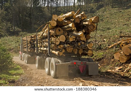 a log truck leaves the site landing with a load of conifer logs destined for the mill in southern Oregon