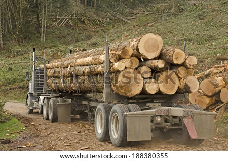 a log truck leaves the site landing with a load of conifer logs destined for the mill in southern Oregon
