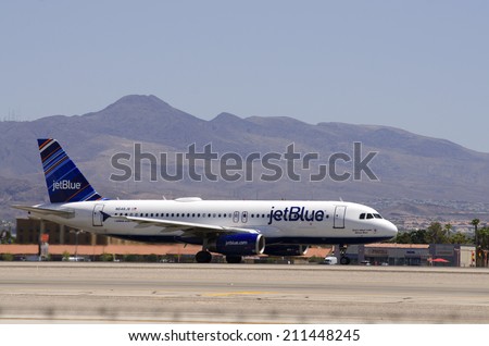 LAS VEGAS, NV, USA  - JUNE 24, 2014: A Jet Blue Airline Passenger Jet prepares for take-off at Las Vegas International Airport on June 24, 2014.