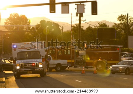 ROSEBURG OR, USA - JULY 12, 2014: Roseburg Oregon Police and Fire deparment at the scene of a single car accident that knocked over a fire hydrant, July 12, 2014