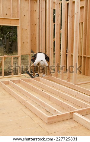 Framing building contractor framing up a wall section for a luxury custom house