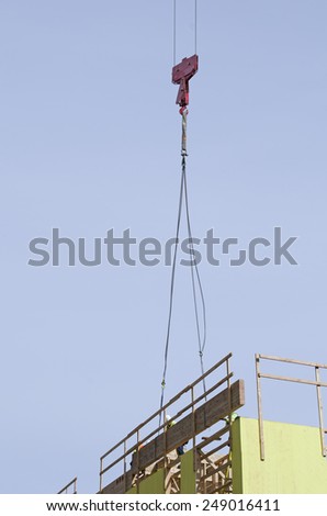 Large tower crane at a modern urban, development construction site  in an concrete and metal project