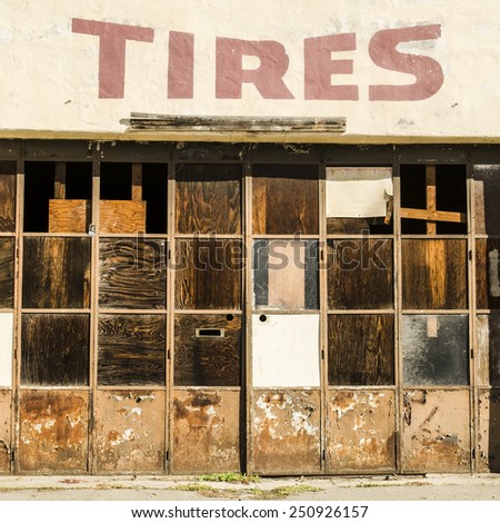 Old long closed up tire shop in a small town on an old highway in northern California