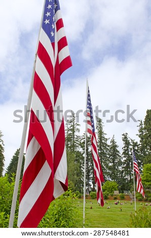 veterans cemetery memorial celebration with American Flag.