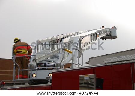 Inservice training on a new 100 foot platform fire truck.  Working with ladder placement and elevated master streams.