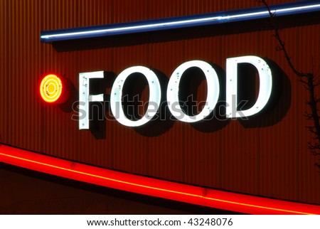 Neon Food sign on a shopping center building in Portland Oregon