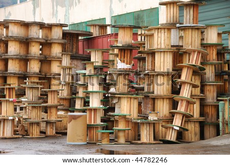 Empty+Electrical+Spools Empty wooden spools outside of a metal wire cable supplier in the ...
