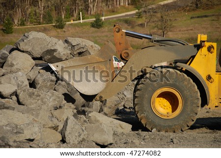 Excavation equipment moving the blasted rock during a large construction project in Roseburg Oregon