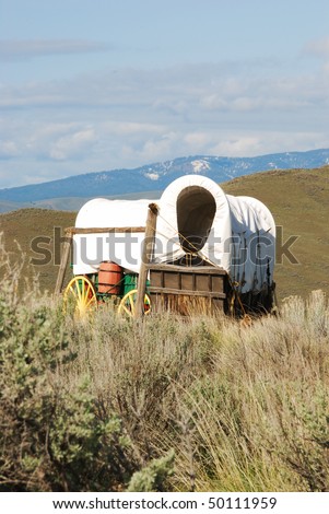 The National Historic Oregon Trail Interpretive Center near Baker City Oregon.  Wagons at the Center with the Blue Mountains in the background