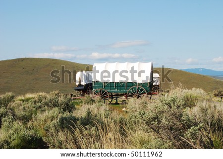 The National Historic Oregon Trail Interpretive Center near Baker City Oregon.  Wagons at the Center with the Blue Mountains in the background