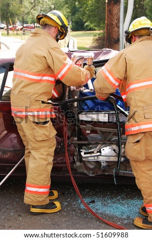 rescue tool to remove a door, 2 vehicle T-Bone accident passenger car and  dump truck, single person injured and entered into trauma system, Stewart Parkway and Mercy Drive, Roseburg OR
