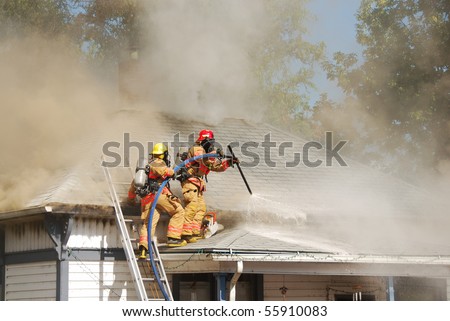 Lt Martin and FF Sullivan performing horizontal ventilation on a Single family dwelling on fire on SE Mill Street in the Mill Pine Historic District of Roseburg Oregon.