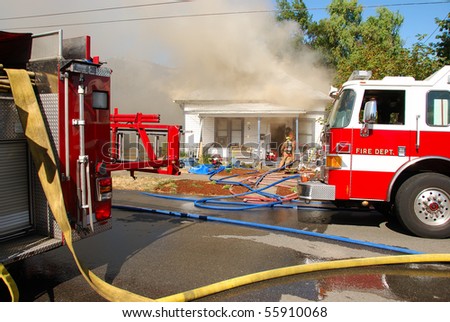 Attack and Backup lines in front of a Single family dwelling on fire on SE Mill Street in the Mill Pine Historic District of Roseburg Oregon.