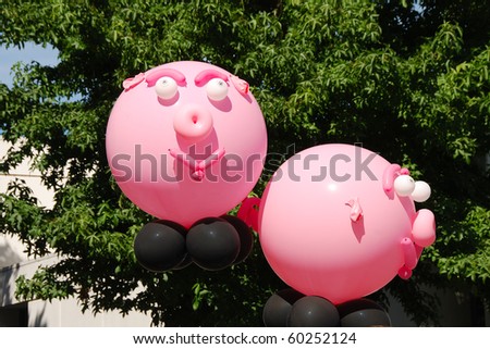Feed the Pig balloon piggy banks at the Eugene Celebration in Oregon