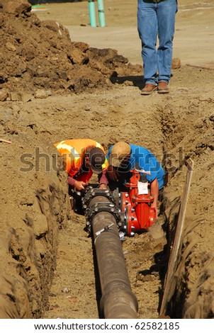 Installing a new water supply pipe on a new commercial building site in Roseburg Oregon