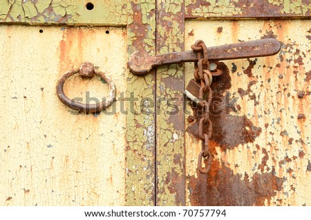 Detail of and old padlock and chain of a old commercial building in the old downtown area of Harrisburg Oregon