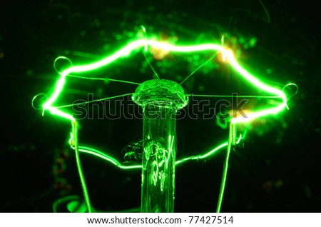 Lightbulb experiment showing heated filament in green bulb