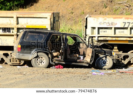 WINSTON, OR - JUNE 14: A sport utility vehicle with five occupants hit parked railroad cars near Winston Oregon.  All occupants recieved non life threatening injuries. June 14, 2011 in Winston, OR
