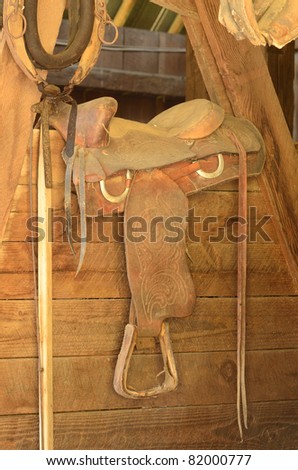 Old western saddle in a horse barn