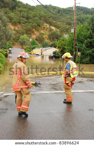 ROSEBURG, OR - AUGUST 29: Roseburg Fire Fighters dealing with flooding at a major water main leak on Harvard Ave, August 29, 2011 in Roseburg, OR