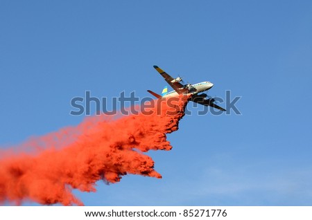 Large air tanker dropping fire retardant at a working  natural cover fire near Roseburg Oregon