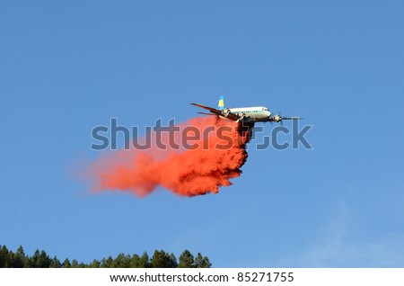 Large air tanker dropping fire retardant at a working  natural cover fire near Roseburg Oregon