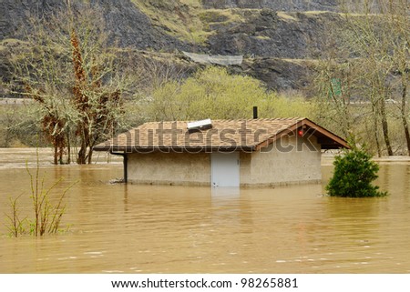 Bathroom building under water as the South Umpqua River floods in late winter