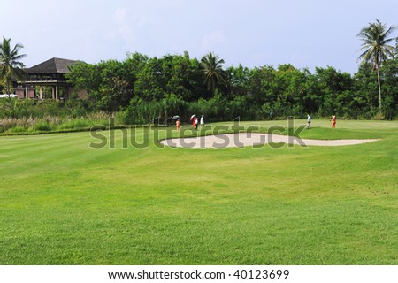 Group of golfers play golf on holiday