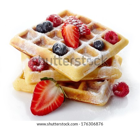 Belgium waffles with fresh berries and caster sugar isolated on white background