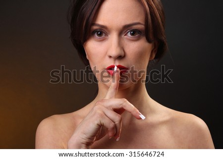woman without dress with finger at the mouth