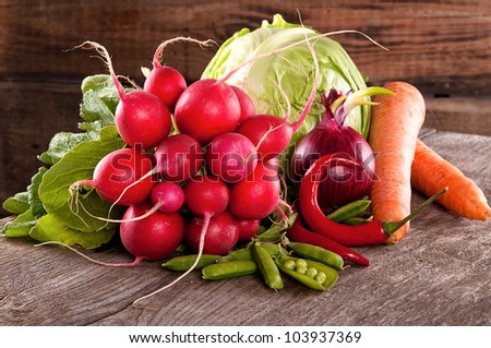 Fresh vegetables on a wooden table in a rustic house. still life