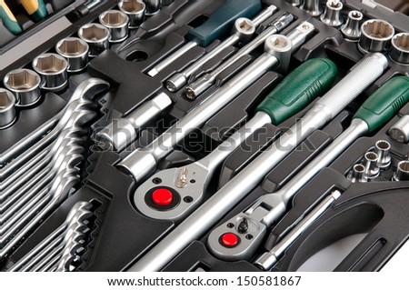 Plastic case with different tools. Isolated on white background