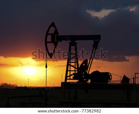 Sunset on oilfield in Asia