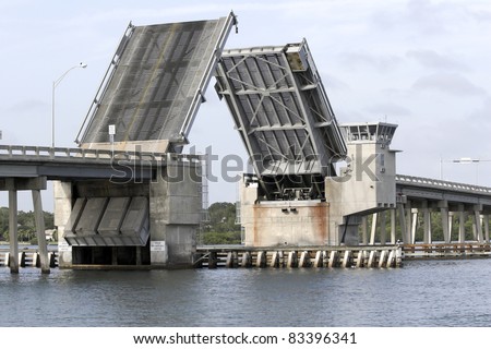 Draw bridge at gulf of Mexico in Florida opening for boat traffic