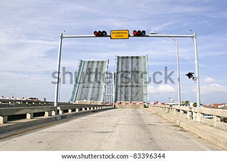 Draw bridge at Gulf of Mexico in Florida opening for boat traffic