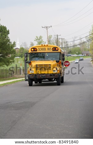 School bus dropping of children after school, traffic staying well back