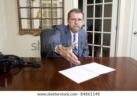 Loan officer at local bank is going to interview business man to better understand his needs