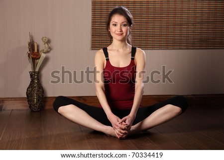 Beautiful asian woman in warm up stretch exercise
