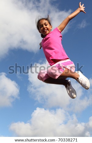 Sky is the limit for joyful young school girl